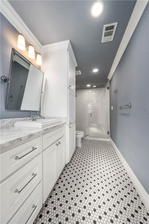 bathroom featuring toilet, tile patterned flooring, an enclosed shower, and ornamental molding