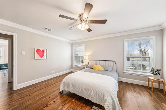 bedroom with ceiling fan, crown molding, dark wood-type flooring, and multiple windows