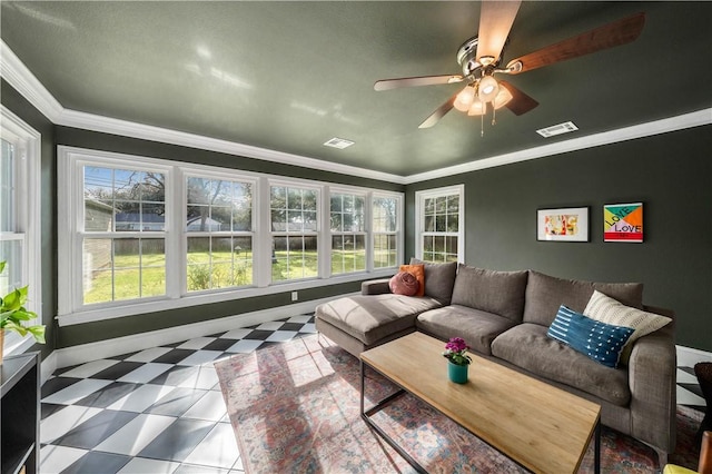 living room with ceiling fan and ornamental molding