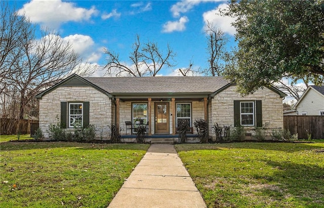 single story home featuring a porch and a front yard