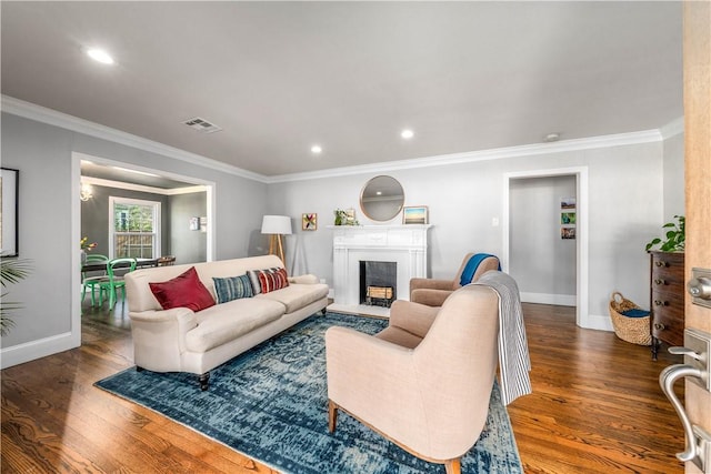 living room with crown molding and dark wood-type flooring