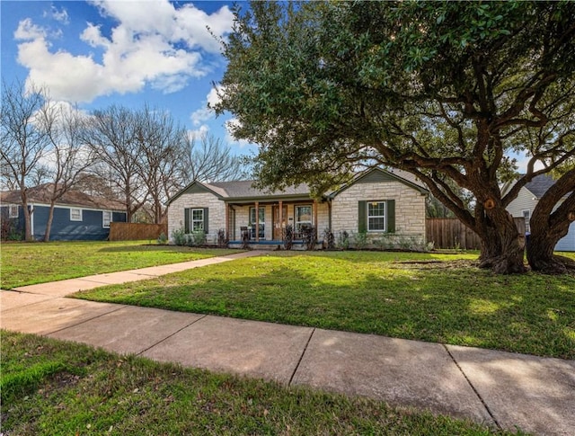 single story home featuring a porch and a front yard