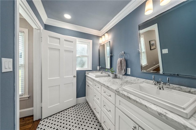 bathroom featuring vanity, plenty of natural light, and ornamental molding