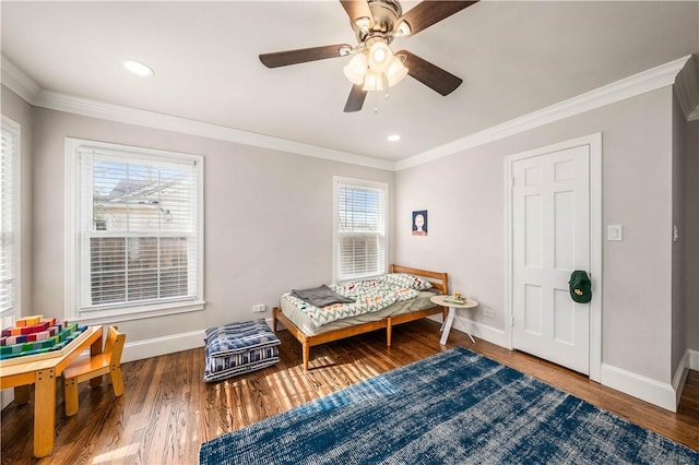 sitting room featuring hardwood / wood-style flooring, ceiling fan, and crown molding