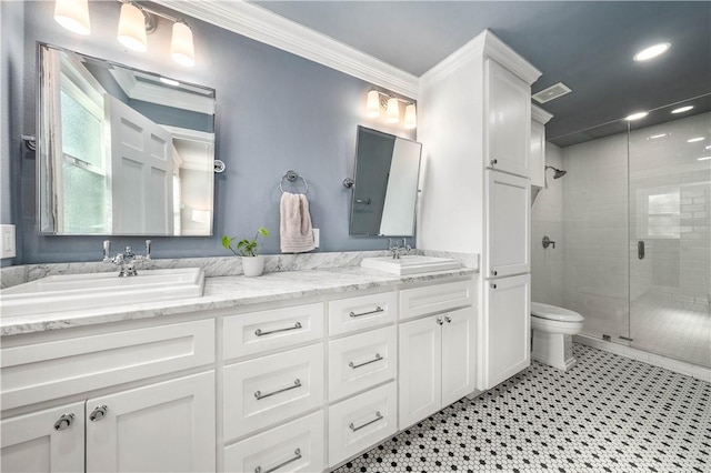 bathroom with a shower with shower door, toilet, ornamental molding, and vanity