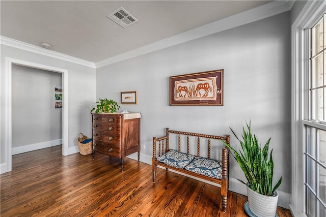 sitting room featuring crown molding and dark hardwood / wood-style floors