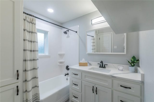 bathroom featuring vanity and shower / bath combo with shower curtain