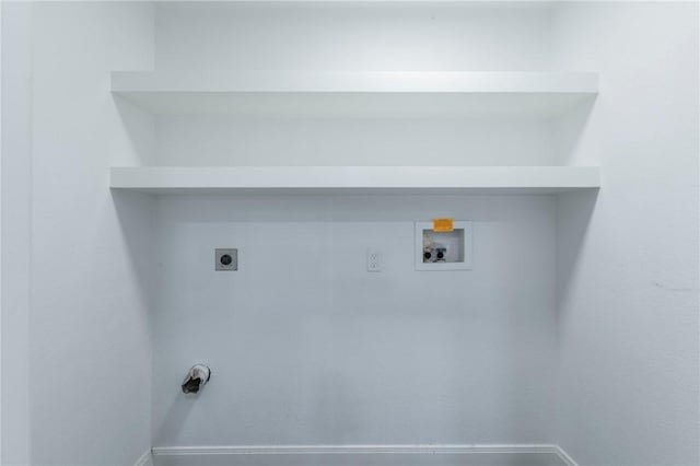 washroom with hookup for an electric dryer and washer hookup