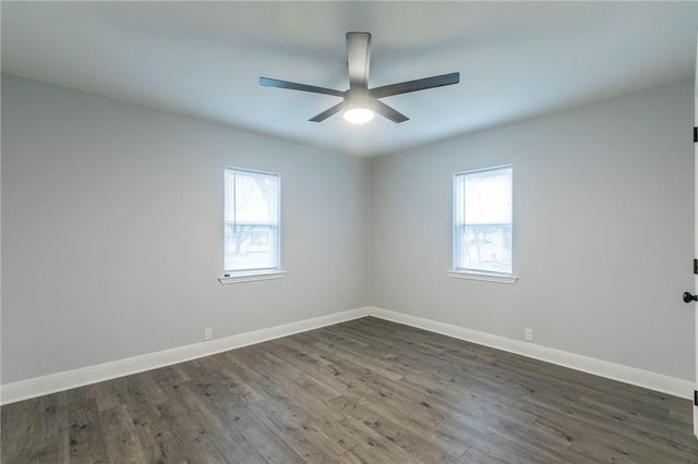 unfurnished room featuring dark hardwood / wood-style flooring and ceiling fan