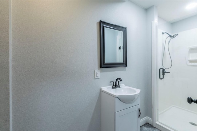 bathroom featuring vanity and a shower