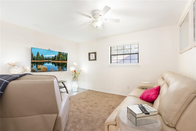 carpeted living room featuring ceiling fan