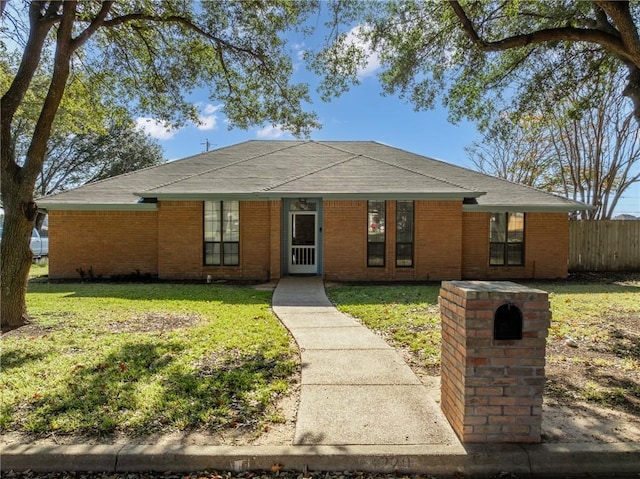 ranch-style home with a front yard