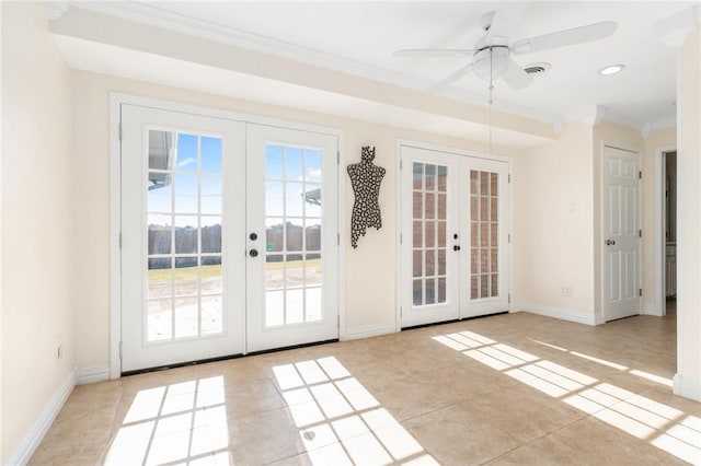 entryway with french doors, light tile patterned floors, ceiling fan, and crown molding