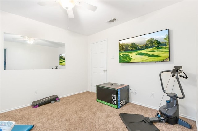 workout area featuring carpet flooring and ceiling fan