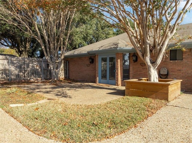 back of house featuring french doors