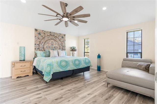 bedroom featuring ceiling fan and light hardwood / wood-style flooring