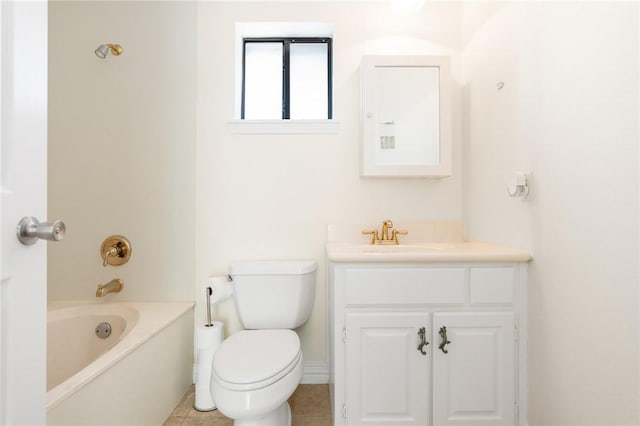 bathroom with tile patterned floors, vanity, toilet, and a bath