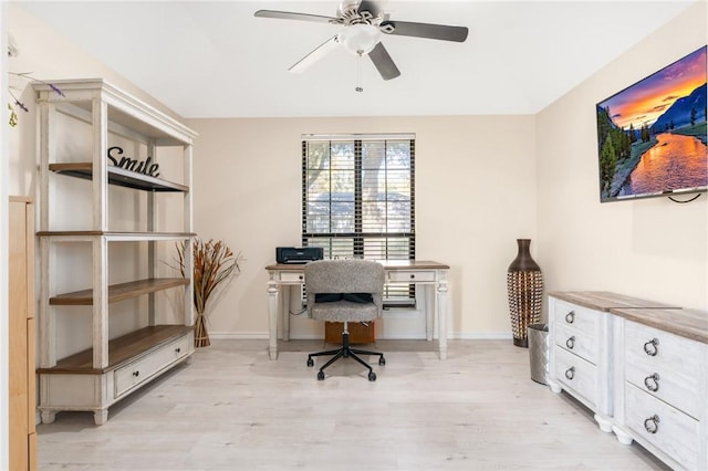 office area with light hardwood / wood-style flooring and ceiling fan