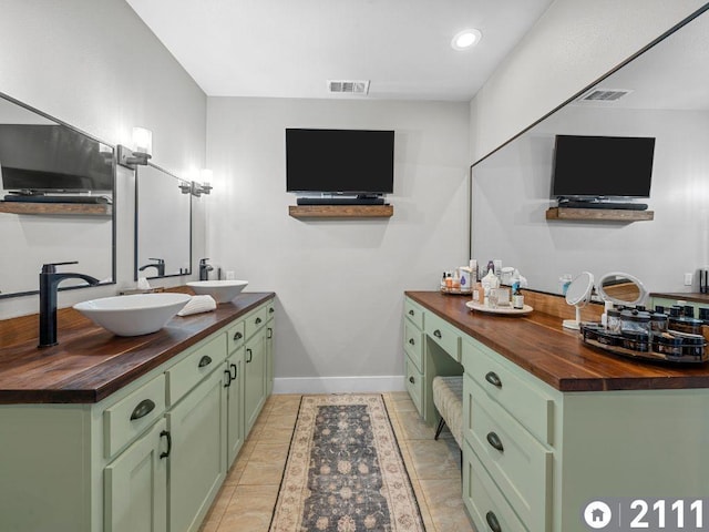 bathroom with vanity and tile patterned floors