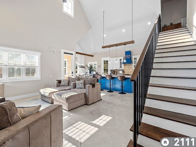 living room featuring a high ceiling