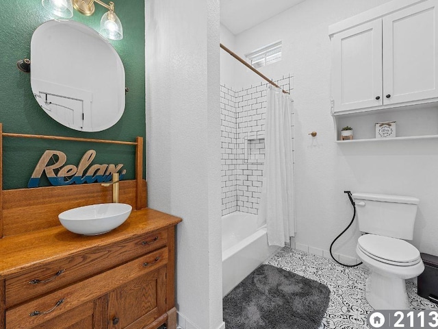 full bathroom featuring toilet, vanity, tile patterned floors, and shower / bath combo with shower curtain