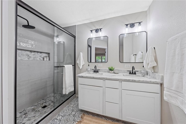 bathroom with vanity and walk in shower