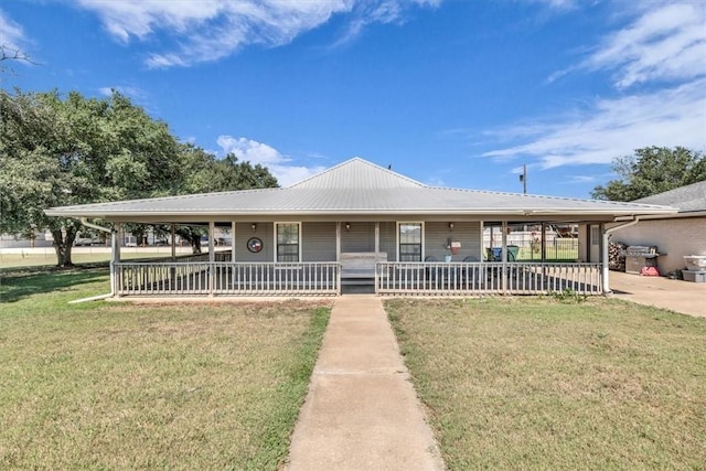 country-style home with a front yard and a porch