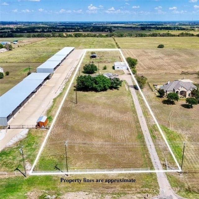 birds eye view of property featuring a rural view