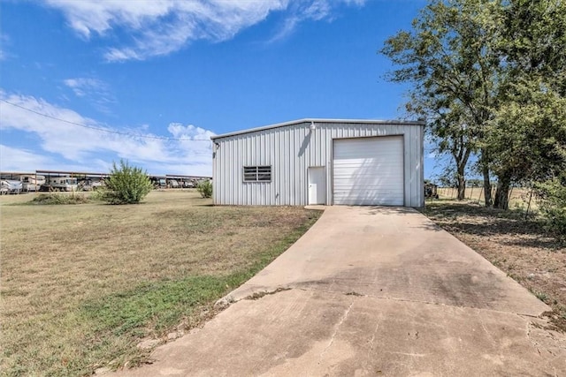 garage featuring a yard