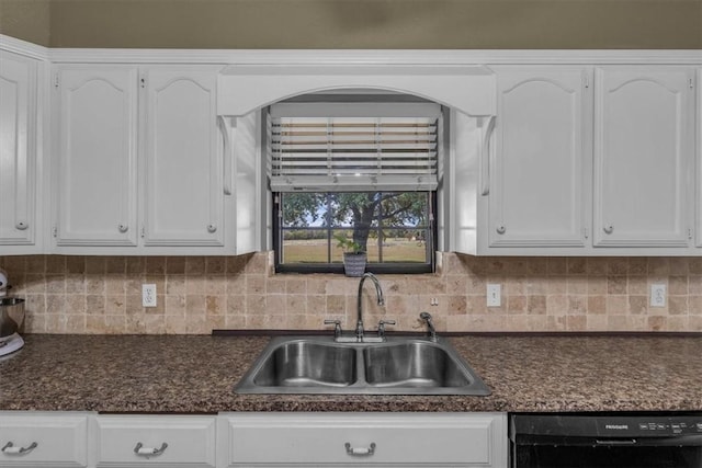 kitchen featuring decorative backsplash, sink, white cabinets, and black dishwasher