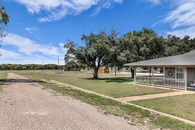 view of yard with covered porch