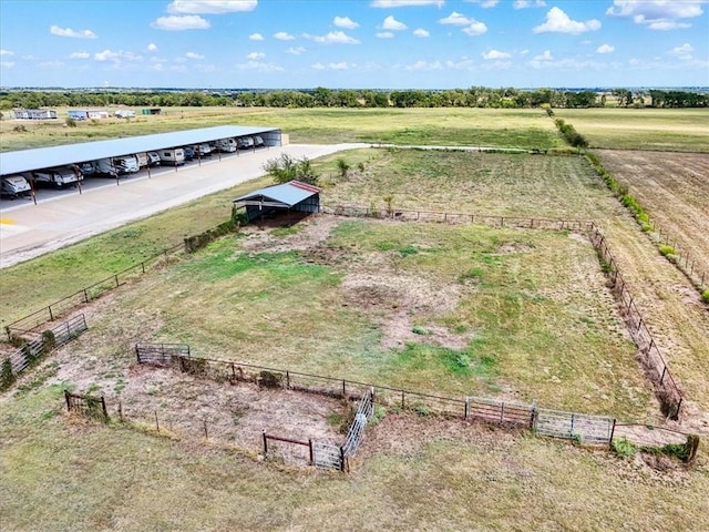 birds eye view of property with a rural view