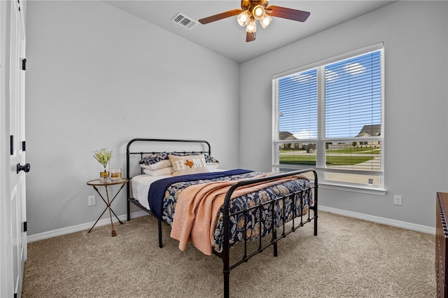 bedroom featuring baseboards, visible vents, ceiling fan, and carpet flooring