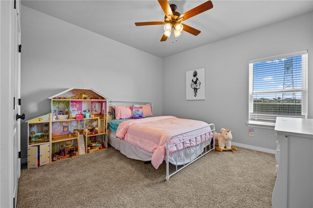 bedroom with carpet floors, ceiling fan, and baseboards