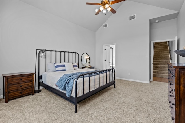 carpeted bedroom featuring ceiling fan, high vaulted ceiling, visible vents, and baseboards