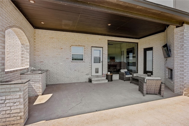 view of patio with entry steps and an outdoor hangout area