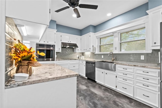 kitchen with light stone countertops, sink, decorative backsplash, white cabinets, and black appliances