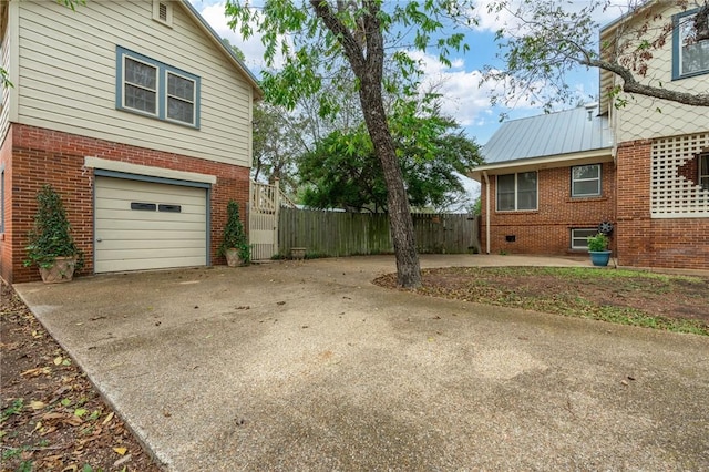 view of property exterior with a garage