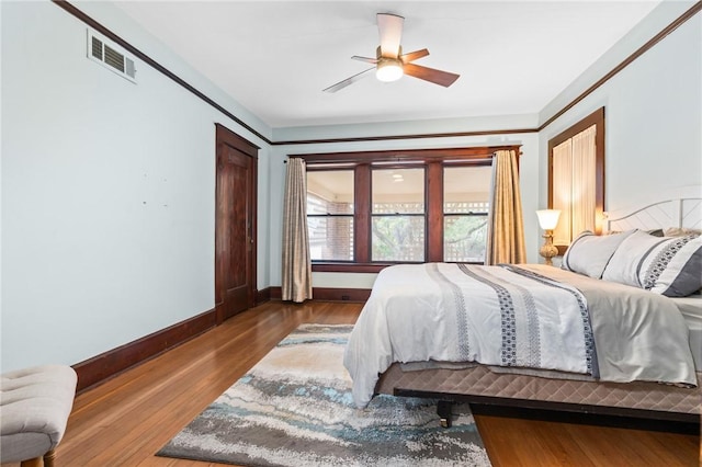 bedroom featuring hardwood / wood-style flooring and ceiling fan