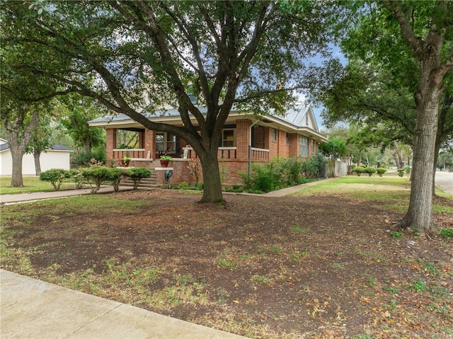 ranch-style house with covered porch