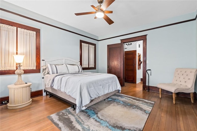 bedroom featuring ceiling fan and wood-type flooring