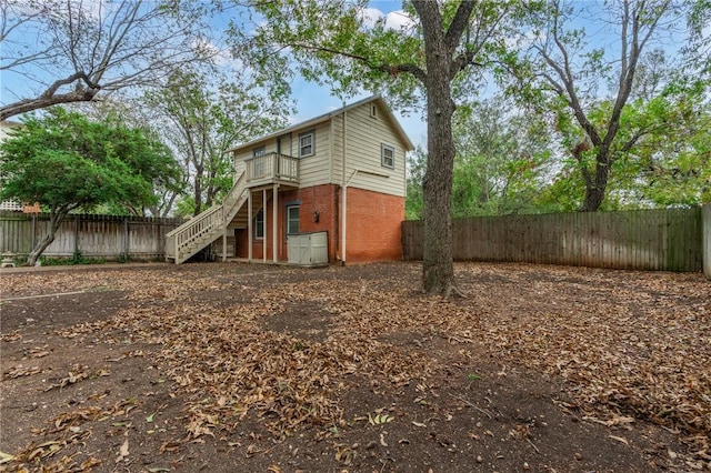 rear view of house with a balcony