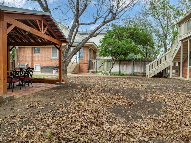 view of yard featuring a gazebo and a patio area