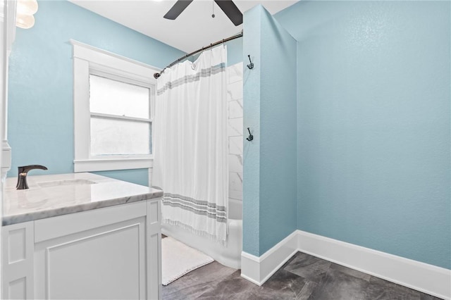 bathroom featuring vanity, ceiling fan, and shower / tub combo