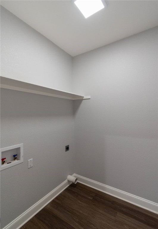 clothes washing area featuring dark hardwood / wood-style flooring, washer hookup, and hookup for an electric dryer