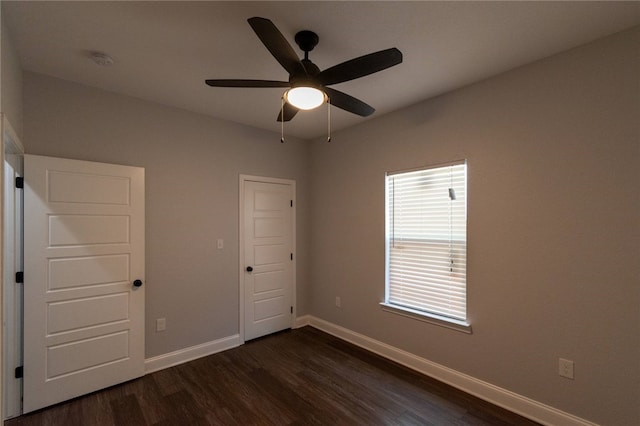 interior space featuring dark hardwood / wood-style floors and ceiling fan