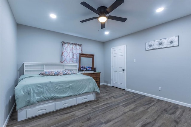 bedroom with ceiling fan and dark hardwood / wood-style floors