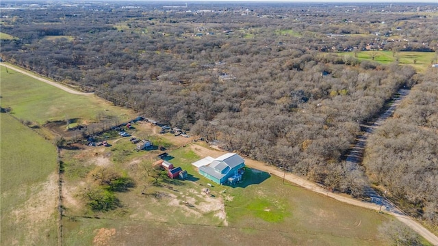 birds eye view of property with a rural view