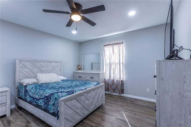 bedroom with ceiling fan and dark wood-type flooring