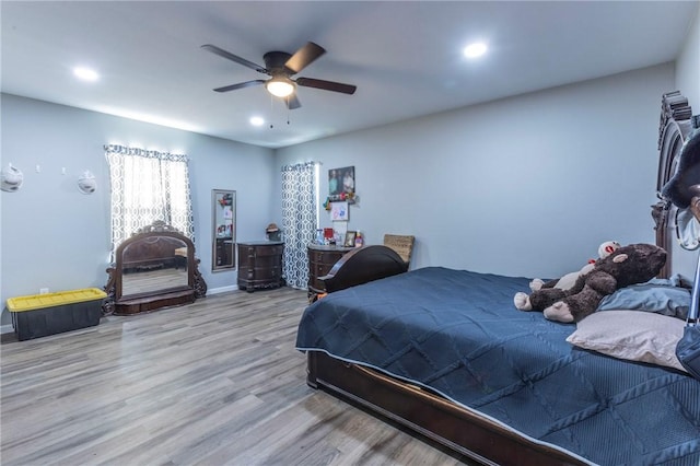 bedroom featuring light hardwood / wood-style flooring and ceiling fan